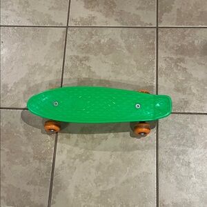 Vibrant Green Kids Skateboard with Orange Wheels